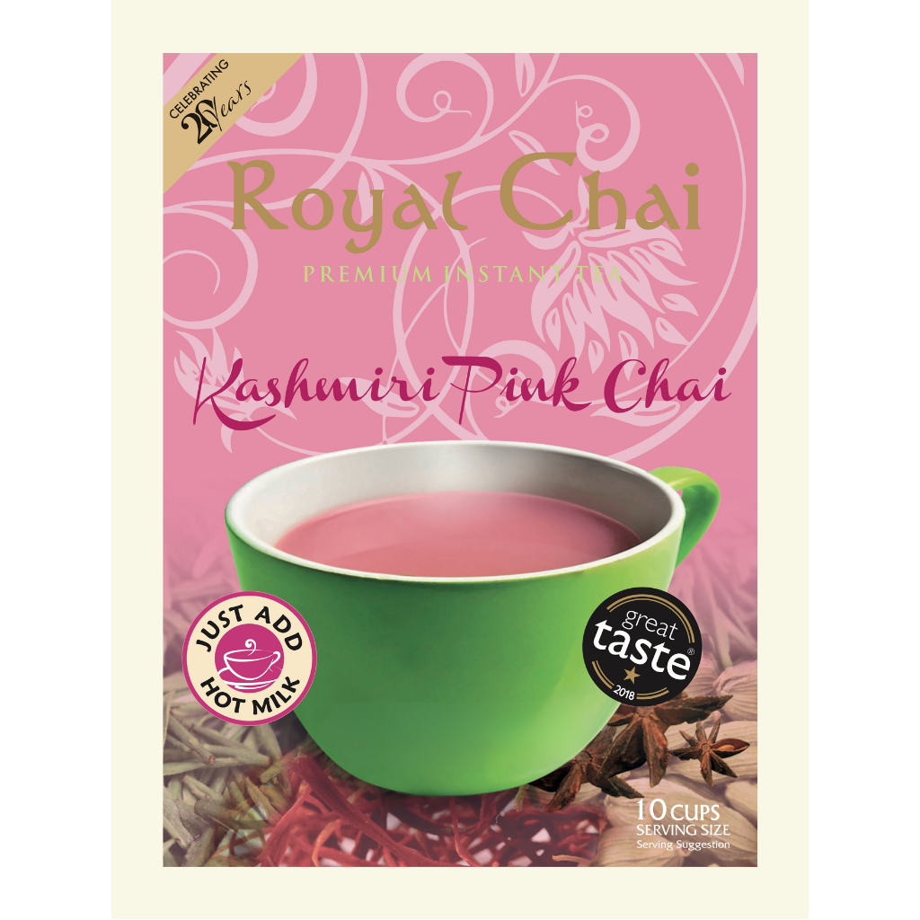 Royal Chai Kashmiri Pink Chai packaging with a green cup of tea and spices on a pink background.