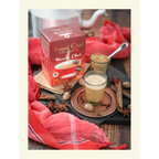 Royal Unsweetened Masala Chai box on a rustic wooden table with a glass of brewed tea, whole spices like star anise and nutmeg, and a traditional red cloth.